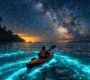 Bioluminescent blue glowing plankton lighting up the water during night kayaking in Havelock Island